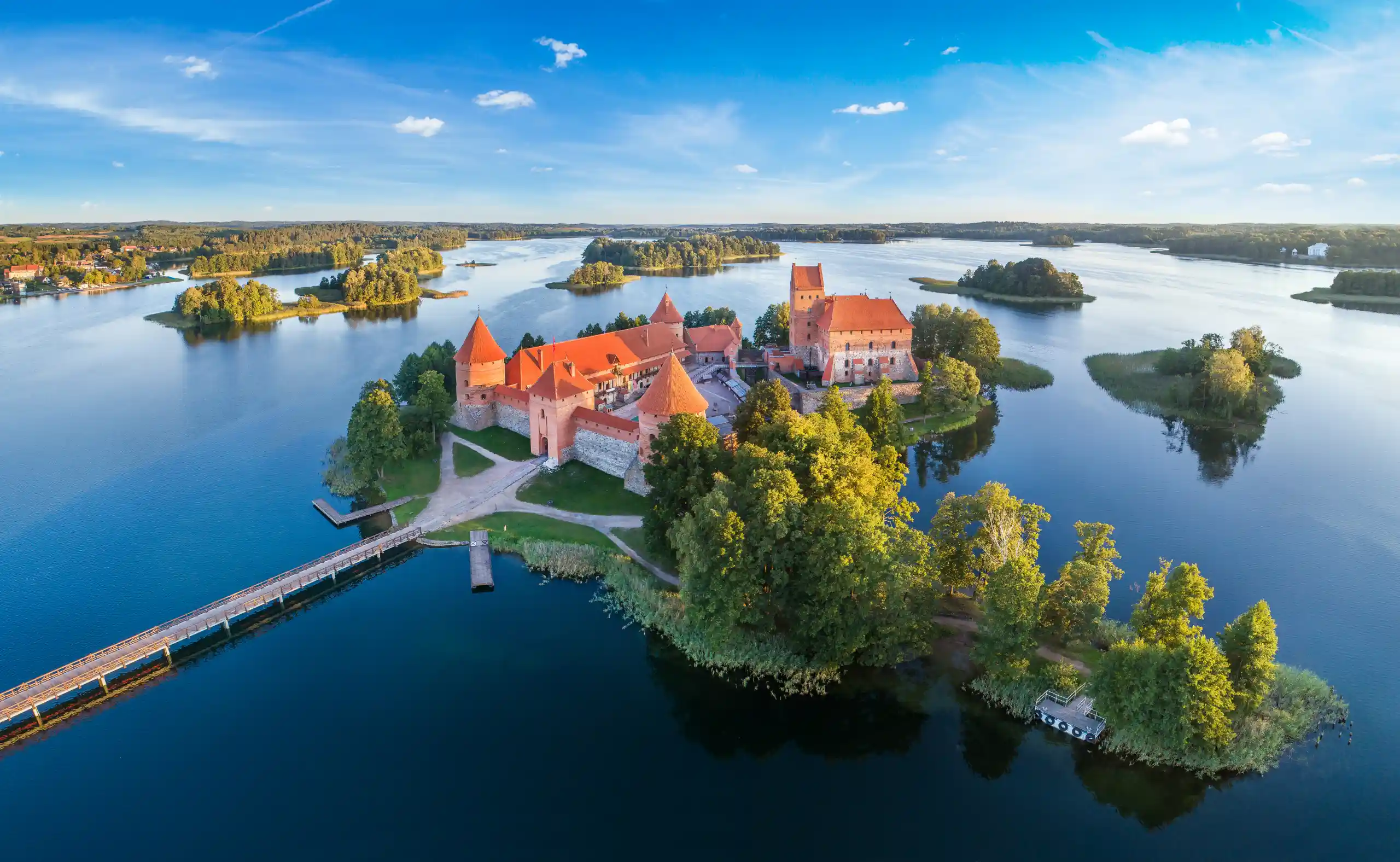 **Lithuania**
Lithuania blends rich history with peaceful landscapes. Admire the Gothic and Baroque architecture of Vilnius, visit Trakai Island Castle on Lake Galvė and explore charming old towns that reveal the country’s cultural heritage.